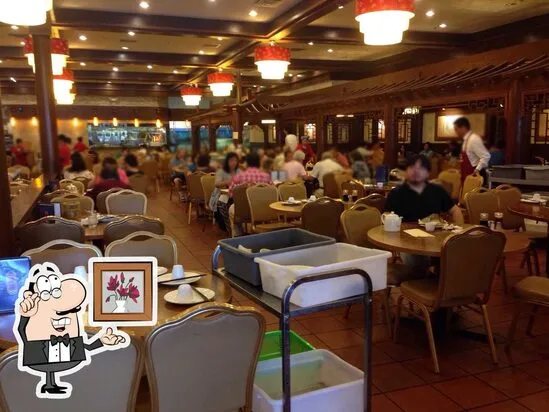 Dining room at Saigon with lanterns, tables, and guests